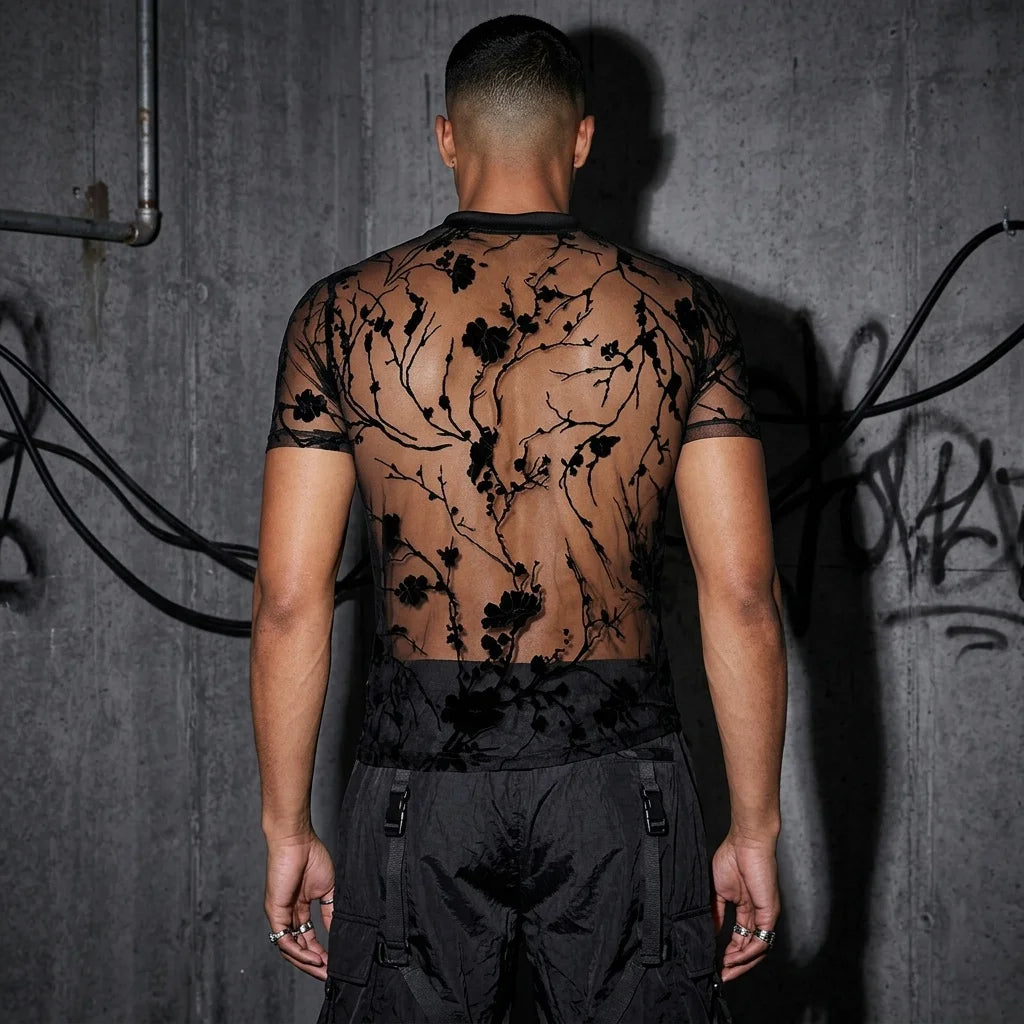 Rückansicht des Shadow Bloom Meshshirts, schwarzes florales Muster, perfekt für Techno-Events.